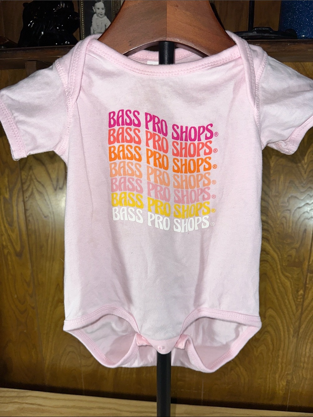 🎉Bass Pro Shops Pink Baby Onesie with Multicolor Stacked Logo. D437